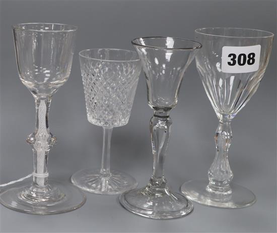 An 18th century wine glass with bucket-shaped bowl on knopped and multi-cottontwist stem and three other wine glasses H.15cm